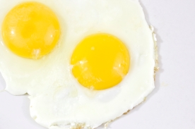 Close up photo of two fried eggs, sunny side up